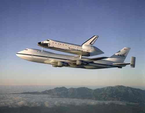 The Space Shuttle Atlantis atop the Shuttle Carrier Aircraft (SCA) returns to the Kennedy Space Center after a ten month refurbishment. 