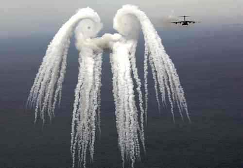 C-17 Globemaster III, having just released a series of flares over the Atlantic Ocean 