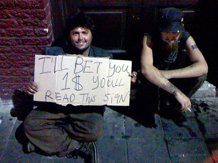 homeless people holding funny sign