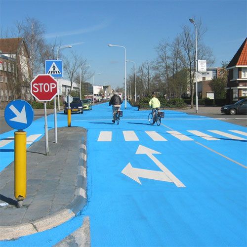 Painting road in blue - street art