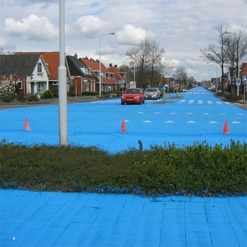 Painting road in blue - street art