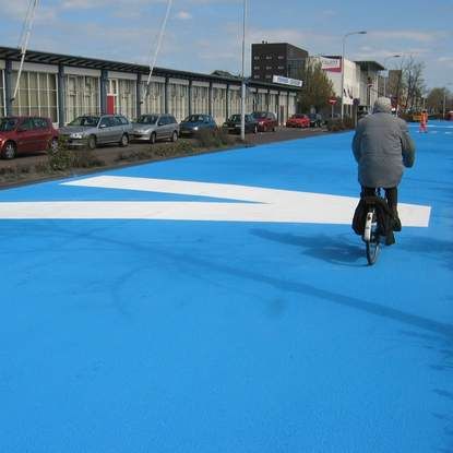 Painting road in blue - street art