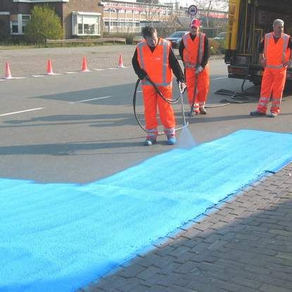 Painting road in blue - street art