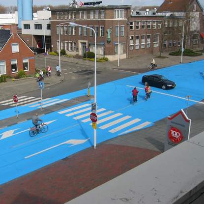 Painting road in blue - street art