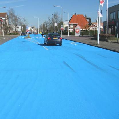 Painting road in blue - street art