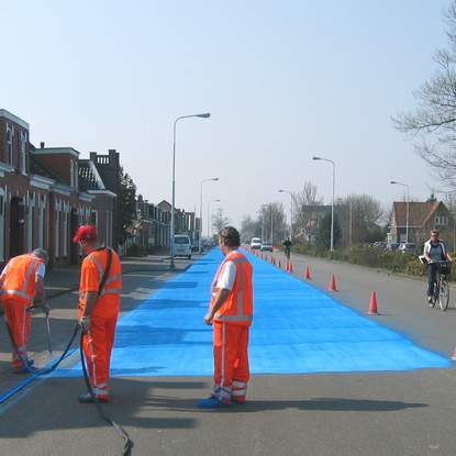 Painting road in blue - street art