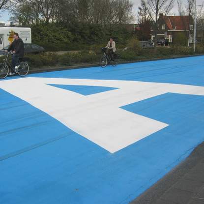 Painting road in blue - street art