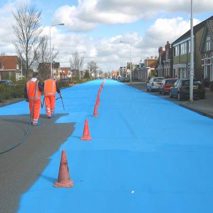 Painting road in blue - street art