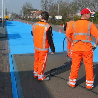 Painting road in blue - street art